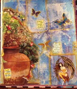 The potted plants are clipped from a magazine and the fairy is an Amy Brown sticker.  I love Amy Brown.